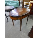 A SATINWOOD WITH INLAID OVAL SIDE TABLE, WITH DRAWERS TO EACH END AND RAISED ON TAPERING LEGS (IN