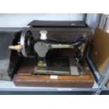 A SINGER SEWING MACHINE, BOXED