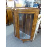 A MID TWENTIETH CENTURY WALNUTWOOD DEMI-LUNE SMALL DISPLAY CABINET, ON STUMP CABRIOLE SUPPORTS