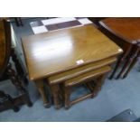 AN 'ADSHEAD' CABINET MADE NEST OF THREE OBLONG COFFEE TABLES