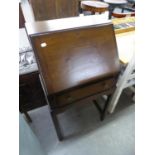 A SMALL OAK BUREAU WITH SLOPING FALL-FRONT, ONE LONG DRAWER BELOW, ON SQUARE TAPERING LEGS, 1'9"