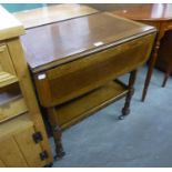 AN OAK PEMBROKE TWO TIER TEA TROLLEY WITH DROP LEAF