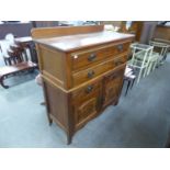 A FLAME MAHOGANY CHEST OF TWO LONG OVER TWO SHORT DRAWERS AND TWO CUPBOARDS BELOW