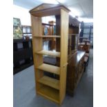 AN 'ADSHEAD' CABINET MADE FIVE TIER OPEN BOOKCASE WITH ARCHITECTURAL PEDIMENT, 2'2" WIDE