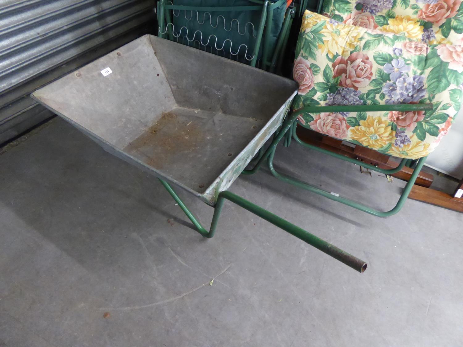 A WHEELBARROW AND TWO FOLDING GARDEN CHAIRS, WITH CUSHIONS