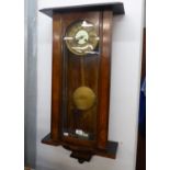 A CIRCA 1900 WALNUT CASED SPRING DRIVEN VIENNA WALL CLOCK (INCOMPLETE CASE)