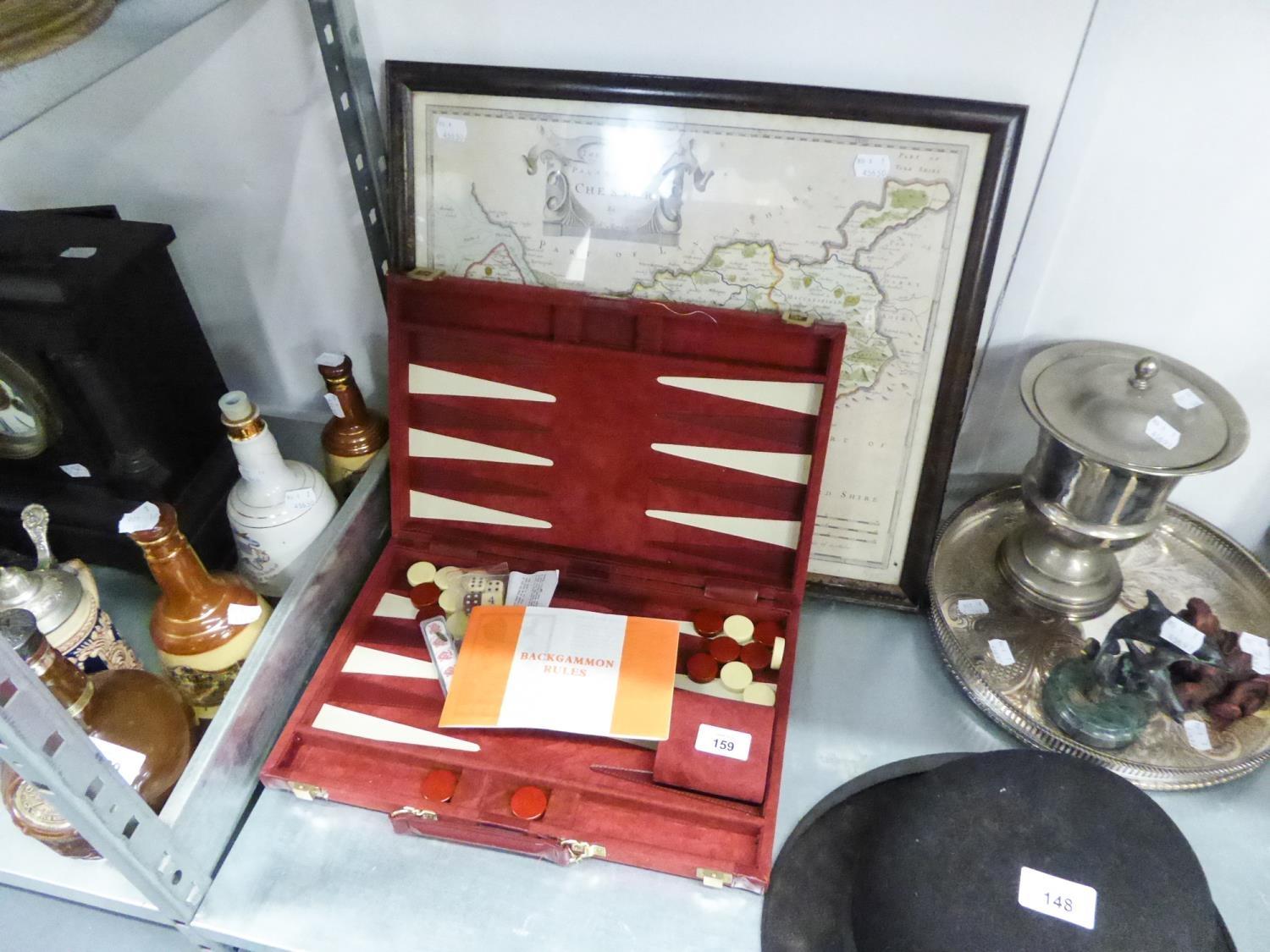 A BACKGAMMON SET IN A RED VELVET CASE AND A FRAMED MAP OF THE COUNTY PALATINE OF CHESTER BY R.
