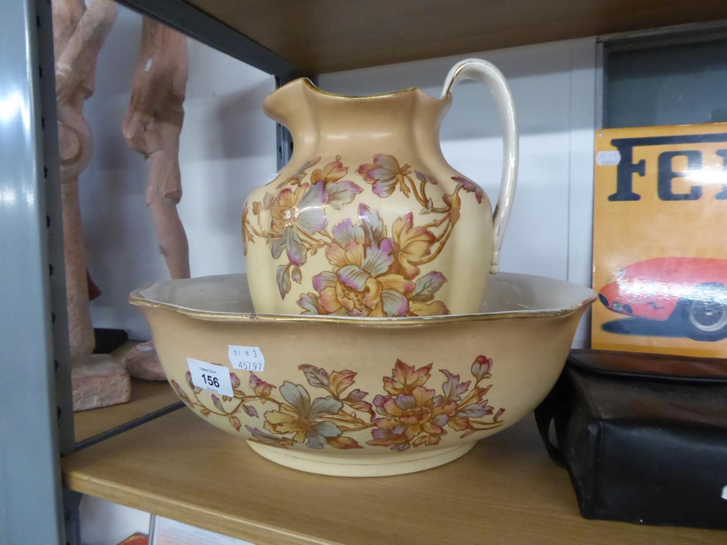 A FLORAL DECORATED TOILET JUG AND BOWL