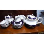 FIFTEEN PIECE ZSOLNAY PORCELAIN TEA SERVICE FOR SIX PERSONS, with blue and gilt borders, comprising: