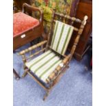 CHILD'S STAINED BEECH AND TURNED WOOD AMERICAN ROCKING CHAIR, the padded back and seat covered in