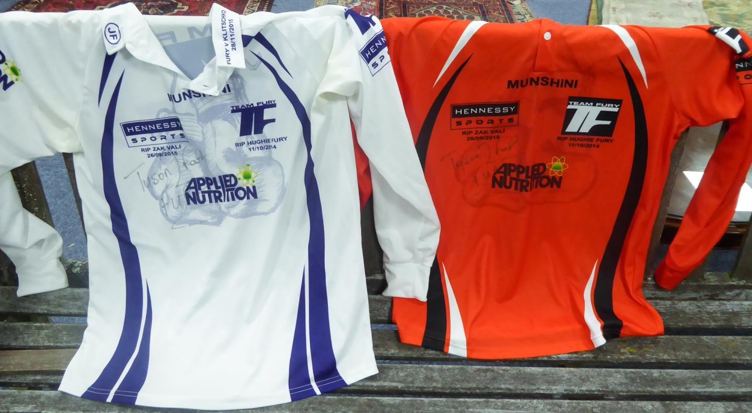 TWO TYSON FURY SIGNED LONG SLEEVED BOXING SHIRTS, both printed for the bout against Klitschko, 28/