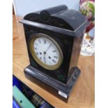 LATE VICTORIAN BLACK SLATE MANTLE CLOCK, the 5 1/2" enamelled Roman dial powered by a drum shaped