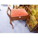 EARLY TWENTIETH CENTURY WALNUT TWO HANDLED PIANO STOOL, of typical form, the hinged seat covered