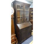 EARLY TWENTIETH CENTURY DARK STAINED OAK LARGE BUREAU BOOKCASE, of typical form with two