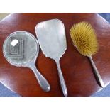 LADY'S SILVER HAND MIRROR AND MATCHING HAIR BRUSH with engine turned decoration; another SILVER HAND
