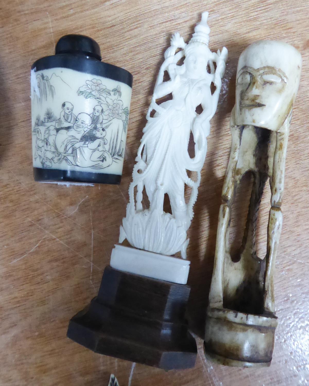 ORIENTAL IVORY AND BLACK WOOD SNUFF BOTTLE and two other MARINE IVORY AND BONE OBJECTS (3)