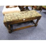 PRIORY STYLE STAINED OAK AND BEECH LONG FOOTSTOOL, with tapestry covered top and turned supports, 15