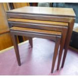 NEST OF THREE TEAK OCCASIONAL TABLES, each with plain oblong top ad square, tapering legs, (3)