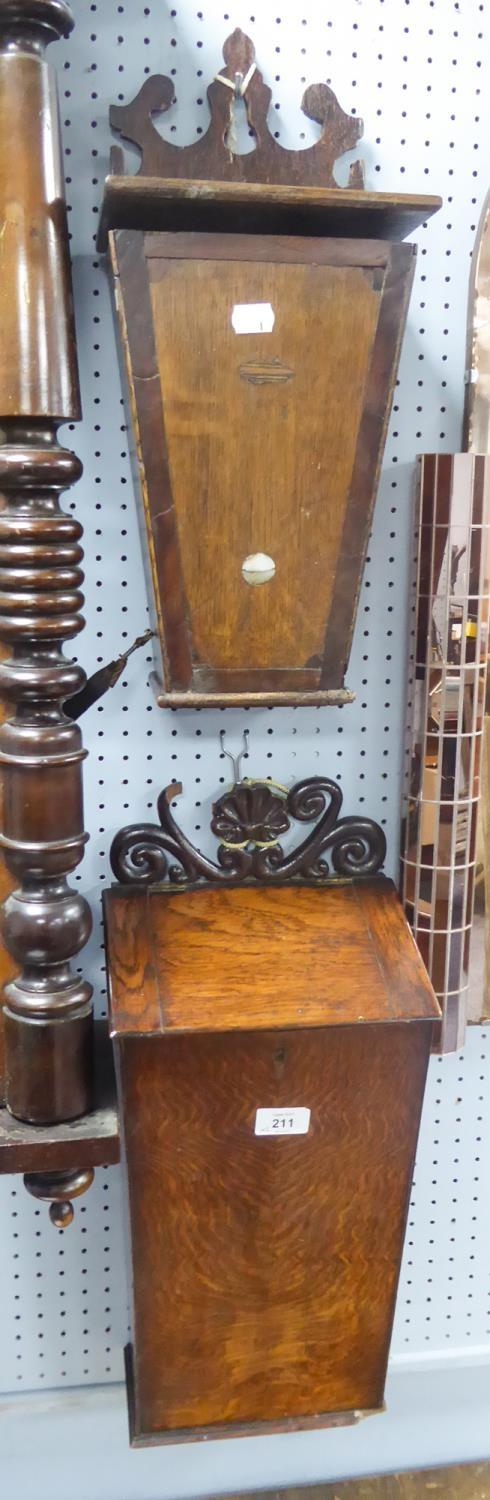 TWO GEORGIAN OAK MURAL CANDLE OR SALT BOXES, each of typical form, one with pierced scroll