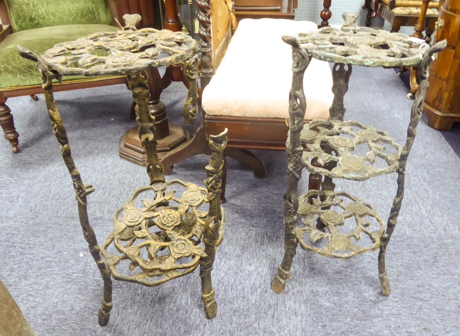 PAIR OF MODERN CAST AND PIERCED METAL THREE TIER CIRCULAR STANDS, each tier moulded with roses,