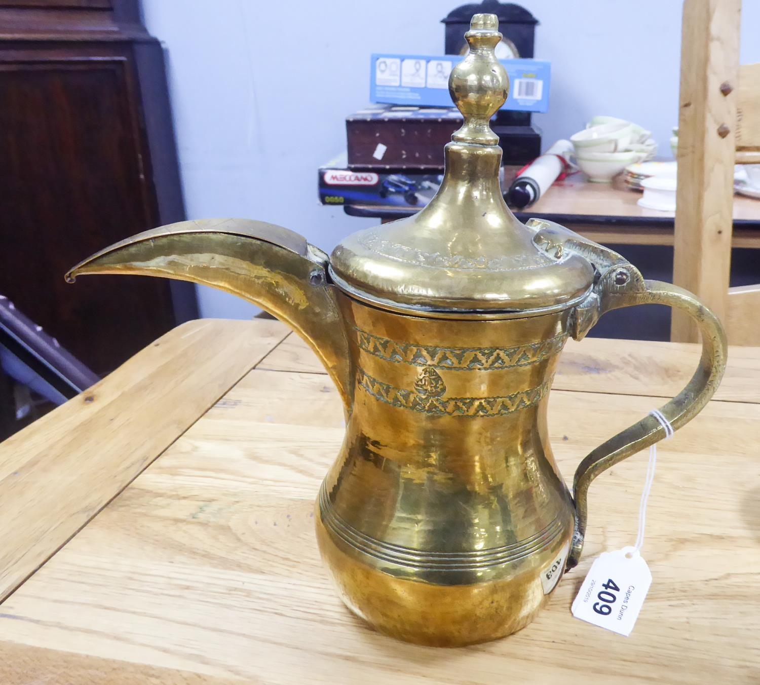 MIDDLE EASTERN CHASED BRASS COFFEE POT, of baluster form with high domed, hinged lid with finial