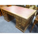 EARLY/ MID TWENTIETH CENTURY PANELLED OAK LARGE PEDESTAL DESK, the moulded oblong top with 'antique'