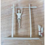 FRENCH PRISONER OF WAR TYPE BONE ARTICULATED MODEL OF AN ACROBAT swinging from a bar, (