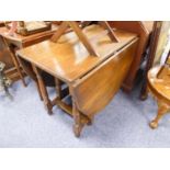 OAK AND STAINED BEECH GATELEG DINING TABLE, with oval top and turned supports, 29" (73.6cm) high,