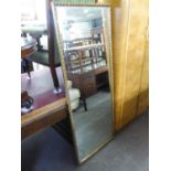 A GILT FRAMED OBLONG ROBING MIRROR (5' X 2')