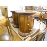 A PAIR OF DREXEL QUARTERED OAK AND CARVED CYLINDRICAL LAMP TABLES/SMALL DRINKS CABINETS, 1?7?
