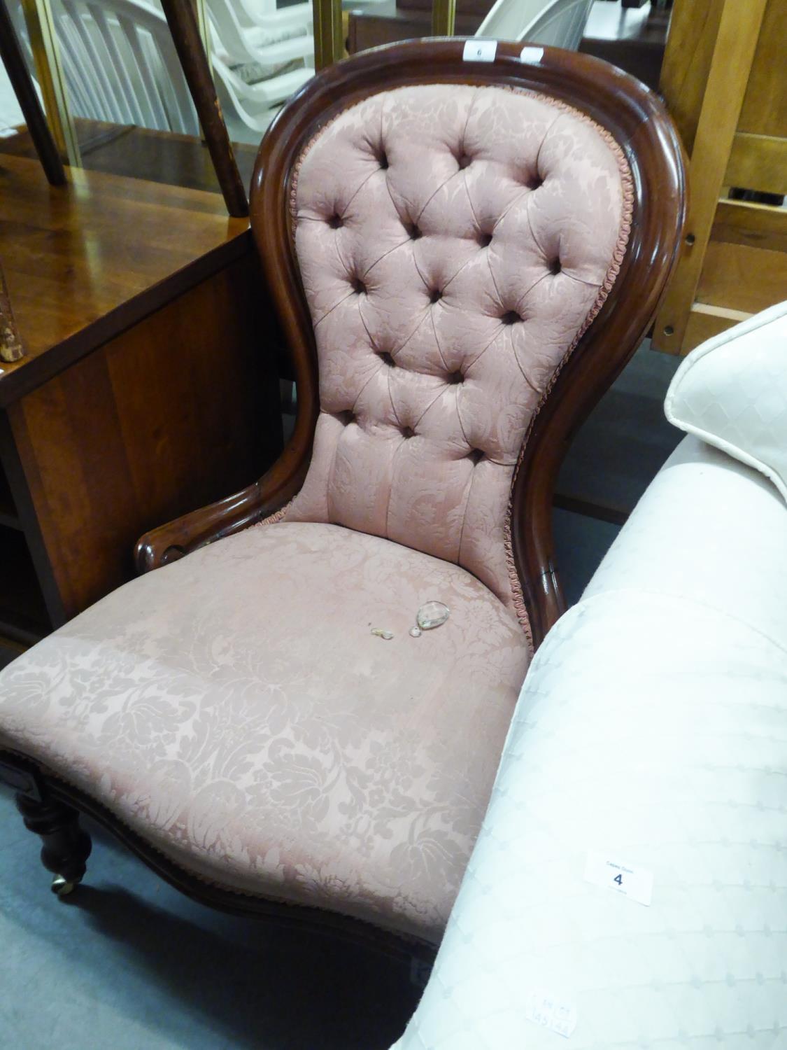 A VICTORIAN SPOON BACK NURSING CHAIR, COVERED IN PINK BUTTON BACK FABRIC