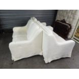 A LOUNGE SUITE OF THREE PIECES RE-COVERED IN WHITE LINING AND FITTED WITH FOLIATE EMBOSSED WHITE