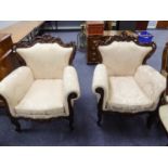 A NINETEENTH CENTURY STYLE THREE PIECE LOUNGE SUITE WITH ORNATE FRAMEWORK, COVERED IN CREAM FLORAL