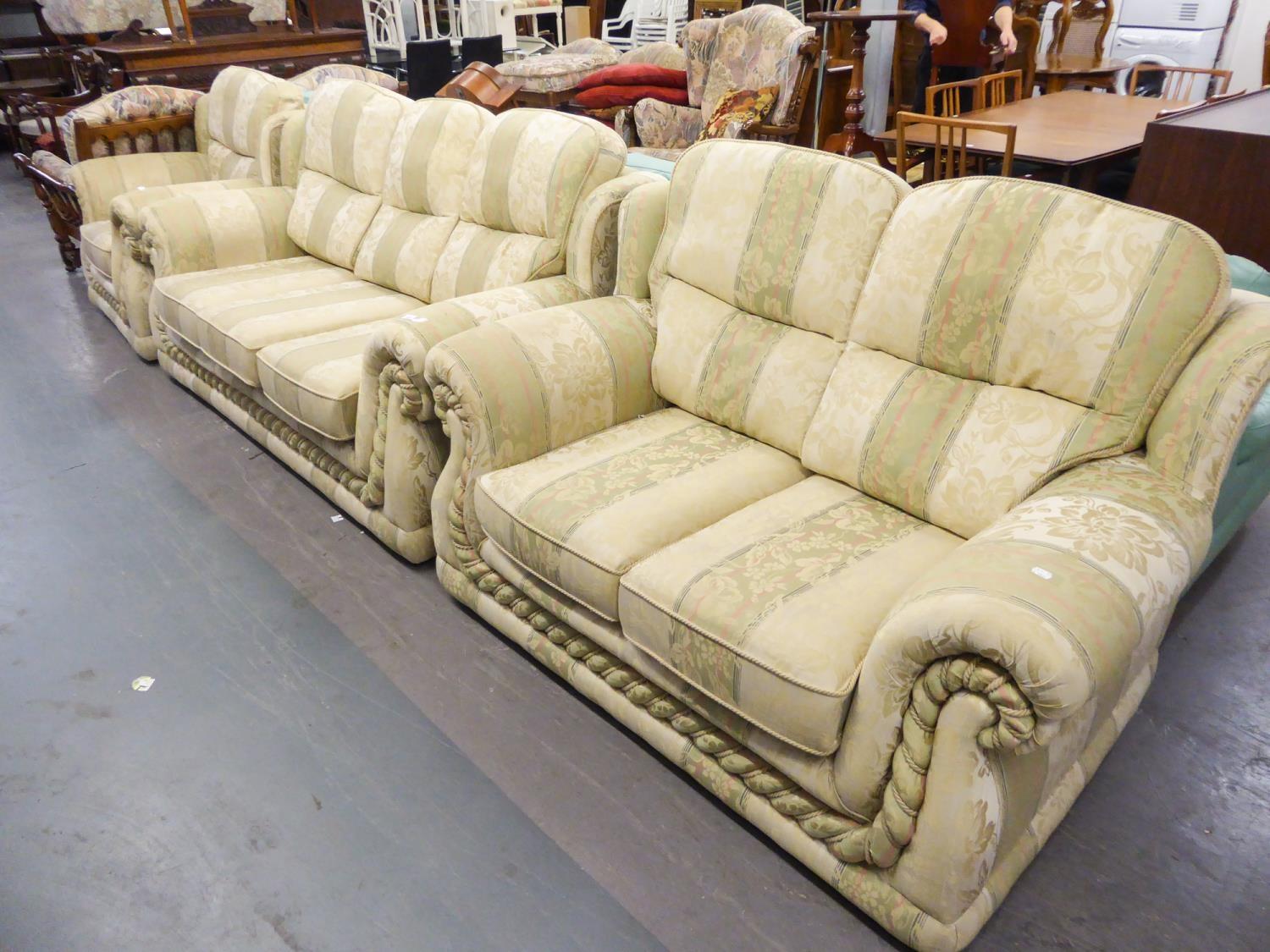 A SEMI-WINGED LOUNGE SUITE OF THREE PIECES COVERED IN STRIPED GOLD TAPESTRY, VIZ A THREE SEATER