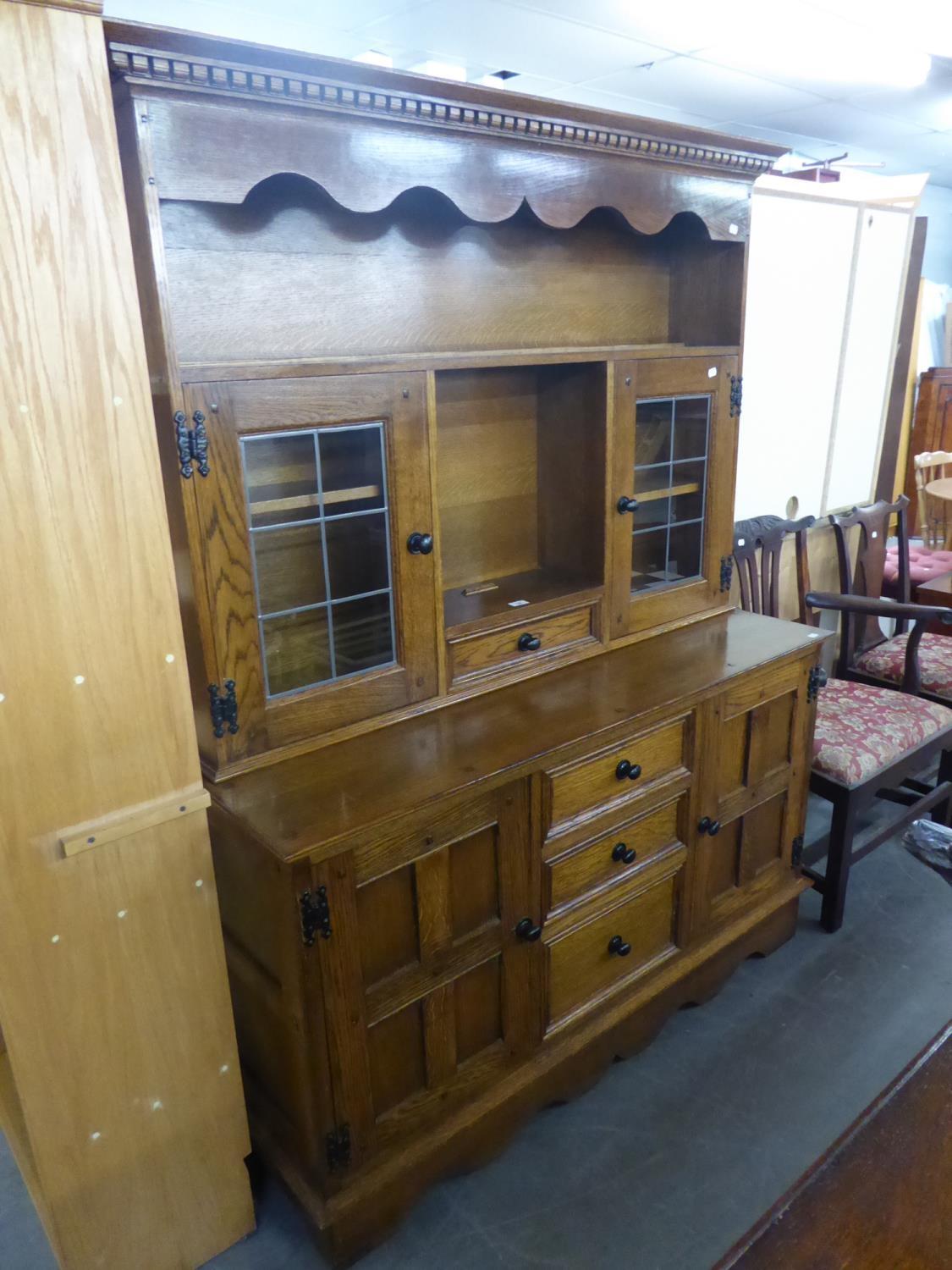 AN 'ADSHEAD' CABINET MADE DRESSER WITH RAISED PLATE RACK WITH GLAZED CUPBOARD, ON BASE WITH THREE