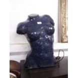 A TABLE LAMP IN THE FORM OF A FEMALE TORSO WITH MOSAIC BLUE GLASS DECORATION AND TWO WICKER