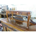 A PATERAE CARVED MAHOGANY OBLONG DUET STOOL OR COFFEE TABLE