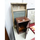 AN OLD GLASS WASH BOARD, 'THE GLASS QUEEN', AND A SMALL MAHOGANY INLAID SMOKERS CABINET (2)