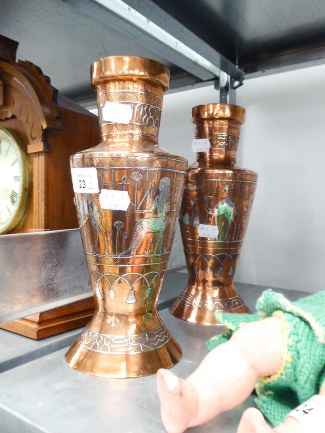 PAIR OF EGYPTIAN COPPER AND SILVER COLOURED METAL VASES