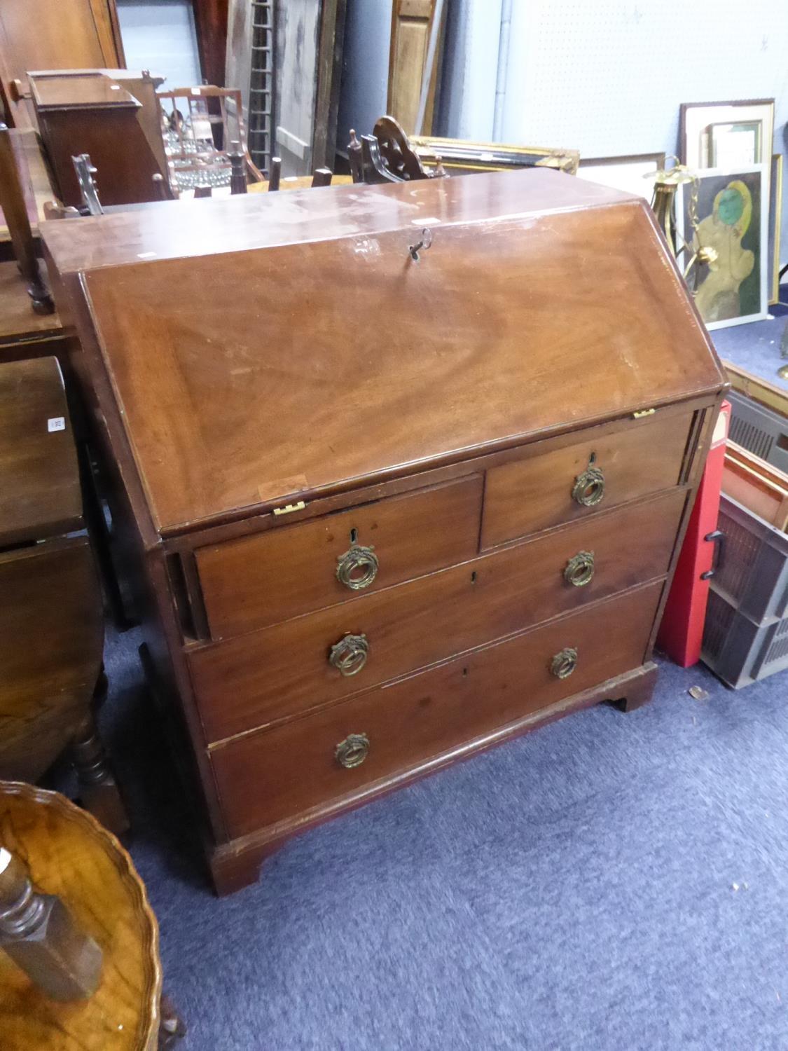 LATE GEORGIAN MAHOGANY BUREAU, of typical form , the interior fitted with short drawers and pigeon