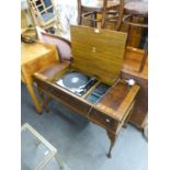 A DYNATRON RADIOGRAM WITH GARRARD TURNTABLE IN MAHOGANY CASE ON CABRIOLE LEGS