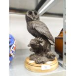 A BRONZED RESIN MODEL OF AN OWL, ON WOODEN PLINTH, 11" HIGH