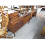A TEAK DOUBLE PEDESTAL DRESSING TABLE WITH SIX DRAWERS AND OBLONG MIRROR AND THE MATCHING CHEST OF