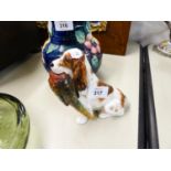 ROYAL DOULTON BROWN AND WHITE SEATED HOUND WITH PHEASANT IN ITS MOUTH, 5" HIGH