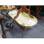 AN ORNATE BRASS COFFEE TABLE WTH OVAL ONYX TOP