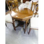 AN EARLY TWENTIETH CENTURY MAHOGANY OCTAGONAL CENTRE TABLE IWTH GALLERIED UNDER PLATFORM (TOP SPLIT)