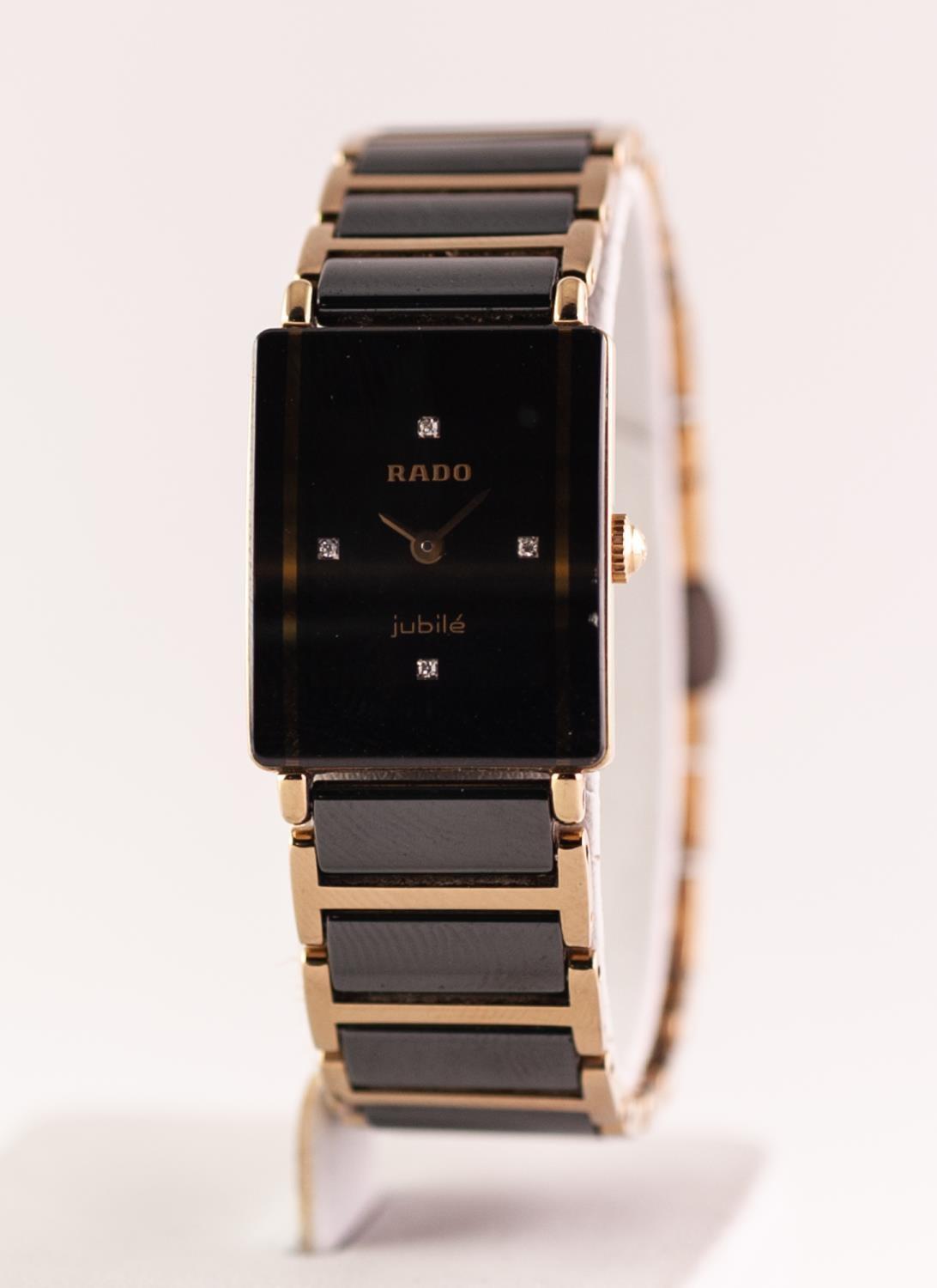 A ladies Rado Jubile quartz wristwatch. Of bicolour design, the rectangular dial signed Rado with