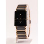 A ladies Rado Jubile quartz wristwatch. Of bicolour design, the rectangular dial signed Rado with