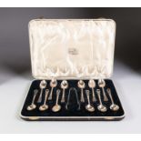 GEORGE VI CASED SET OF TWELVE ART DECO SILVER TEASPOONS AND THE MATCHING PAIR OF SUGAR TONGS BY