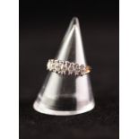 14k YELLOW AND WHITE GOLD DIAMOND SET RING, claw set with seven graduated marquise cut stones, 2.